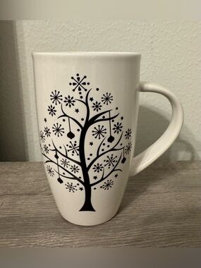 Sweet Expressions. A tall white ceramic mug featuring a black winter tree design